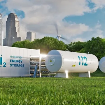 Concept of an energy storage system based on electrolysis of hydrogen in a clean environment with photovoltaics, wind farms and a city in the background. 3d rendering.