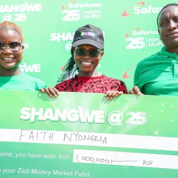 Zizwe Awuor, Director of Brand and Marketing at Safaricom (left), together with Jackson Mutua, Regional Business Lead for the Coast Region at Safaricom (right), presents a cheque to Faith Nyongesa, winner of KES 1 million in the Shangwe @25 campaign, during an award ceremony held at Ibiza Market in Ukunda, Kwale County.