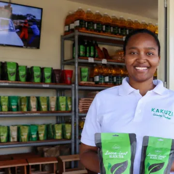 Kakuzi Plc Brand Manager Michelle Dora Wanjiku displays the new Kakuzi Pure Black Tea packs