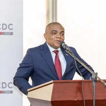 Paty-Paterne Mushagalusa, Associate Director for Commercial Projects at Equity BCDC, giving a speech.