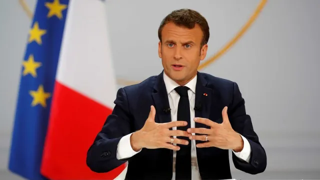 French President Emmanuel Macron speaks during a news conference to unveil his policy response to the yellow vests protest, at the Elysee Palace in Paris