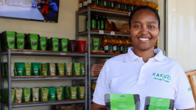 Kakuzi Plc Brand Manager Michelle Dora Wanjiku displays the new Kakuzi Pure Black Tea packs