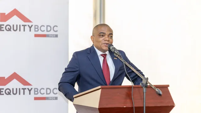 Paty-Paterne Mushagalusa, Associate Director for Commercial Projects at Equity BCDC, giving a speech.