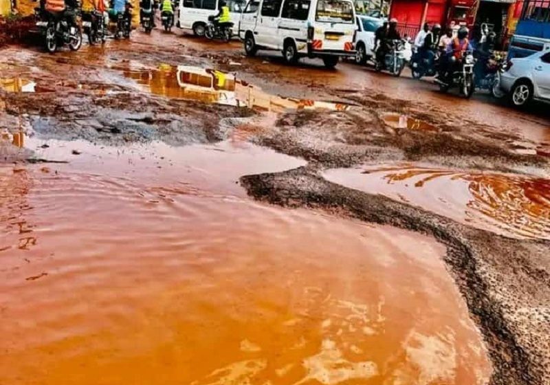  Ugandans mock level of potholes in the country